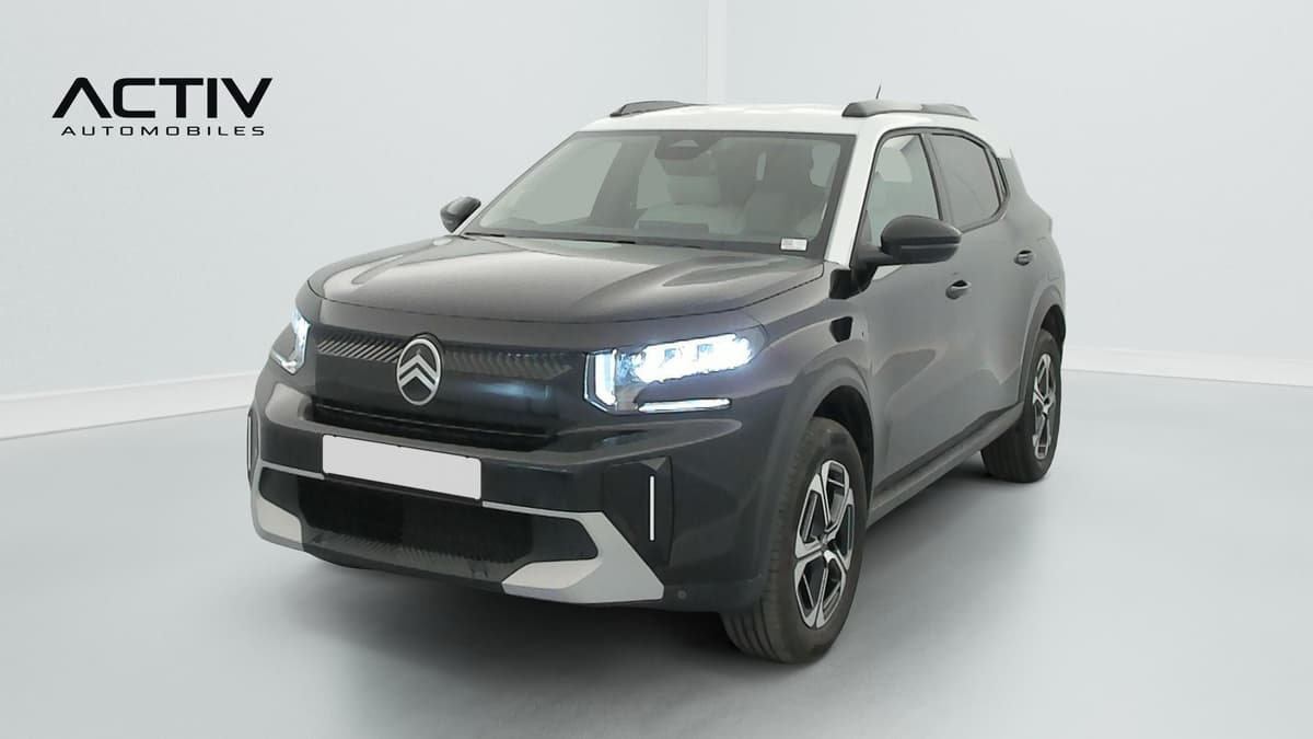 Citroën C3 Aircross : SUV noir à toit blanc vu de trois quarts avant gauche, phares allumés