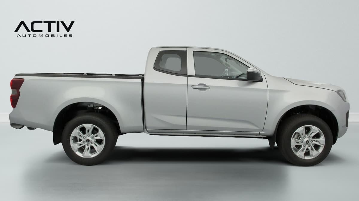 Isuzu D-MAX : profil droit du pick-up gris avec jantes alliage et plateau arrière