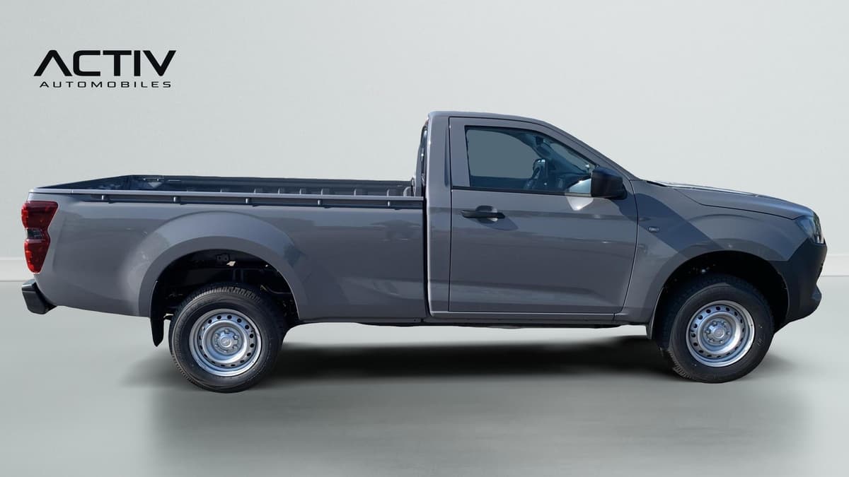 Isuzu D-MAX : profil droit du pick-up gris avec plateau et jantes acier