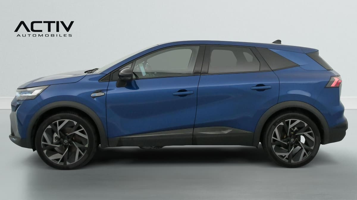 Renault Symbioz : profil gauche du véhicule bleu avec grandes jantes alliage bicolores