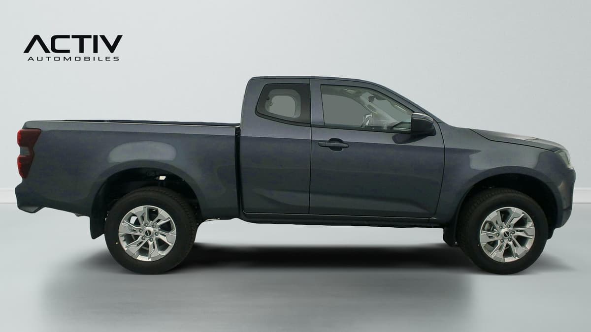 Isuzu D-MAX : profil droit du pick-up gris avec jantes alliage et plateau arrière