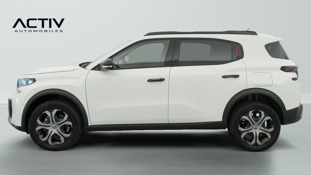 Citroën C3 Aircross : profil gauche du SUV blanc avec barres de toit noires et enjoliveurs