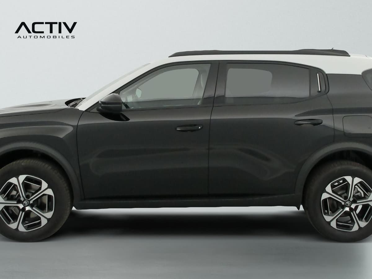 Citroën C3 Aircross : profil gauche noir avec toit blanc, barres de toit et jantes alliage bicolores