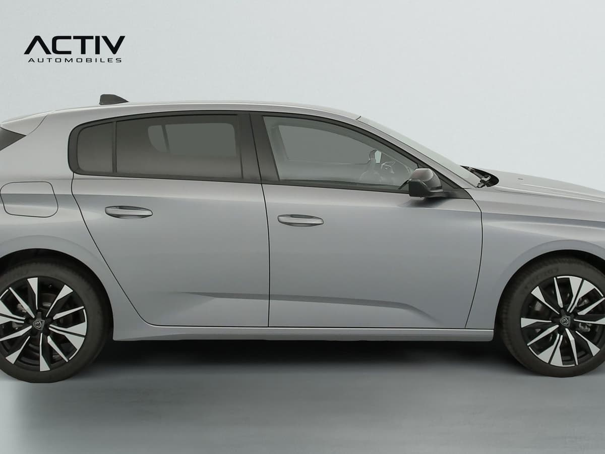 Peugeot 308 Nouvelle : profil droit de la berline grise avec jantes alliage bi-tons