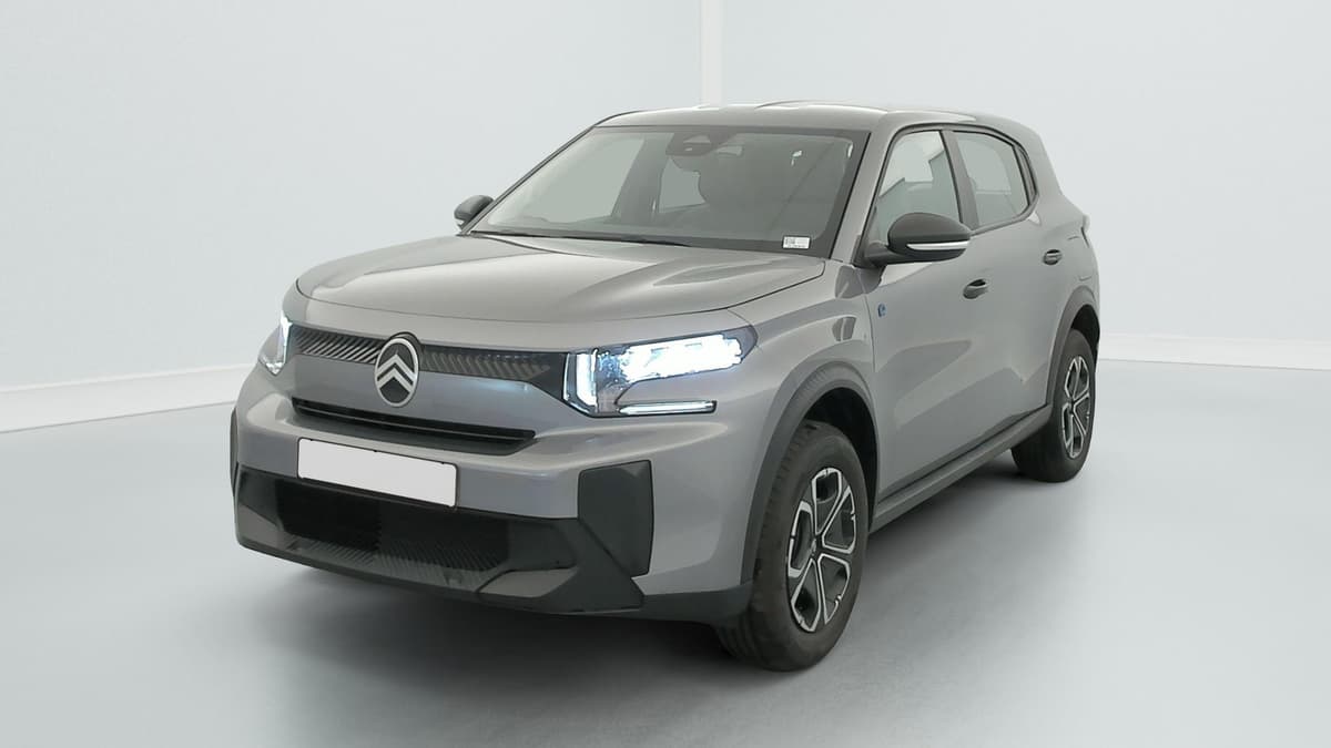 Citroën E-C3 Aircross : SUV gris vu de trois quarts avant gauche avec projecteurs LED allumés